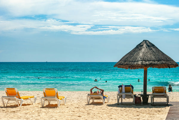 Beach umbrellas on a sunny beach during a summer heat wave